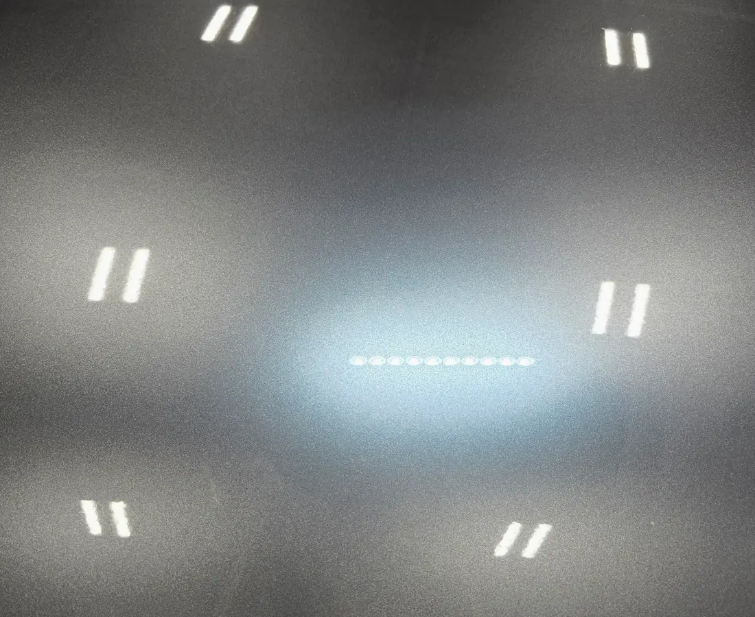 The same panel under the same light after decontamination and a sealed finish