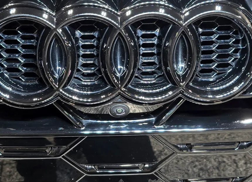 The same grille after decontamination, the black back to gloss