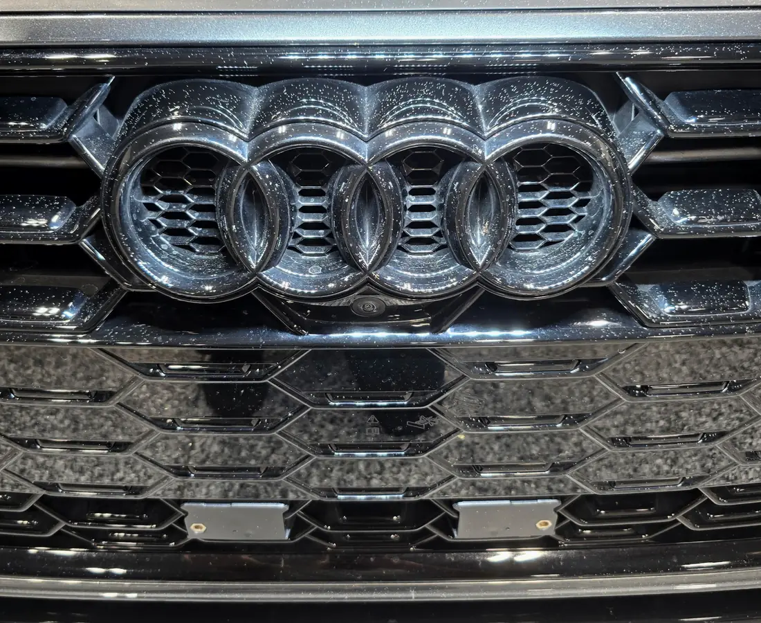 An Audi grille and lower bumper before an exterior detail