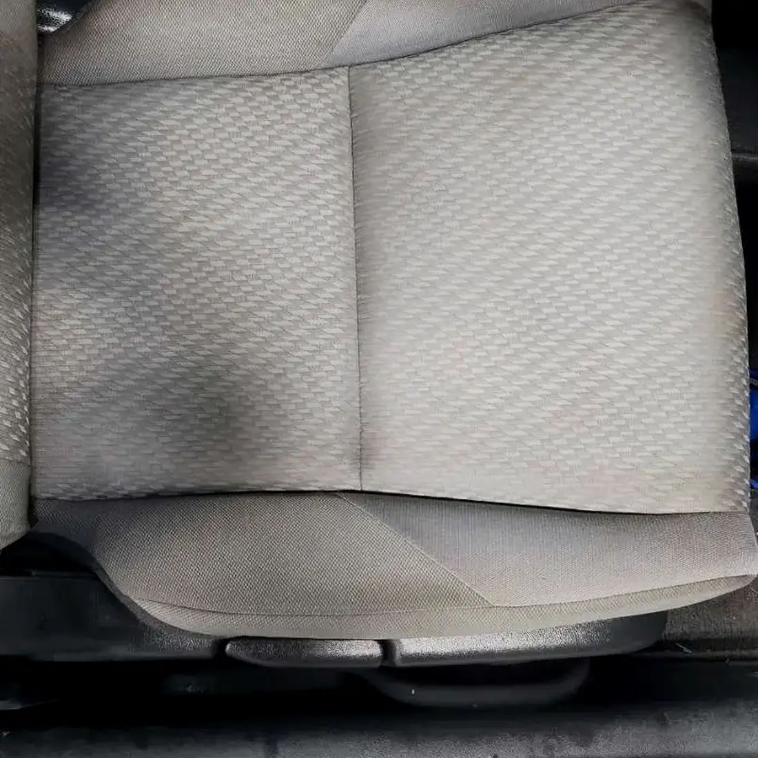 A soiled cloth seat before interior detailing