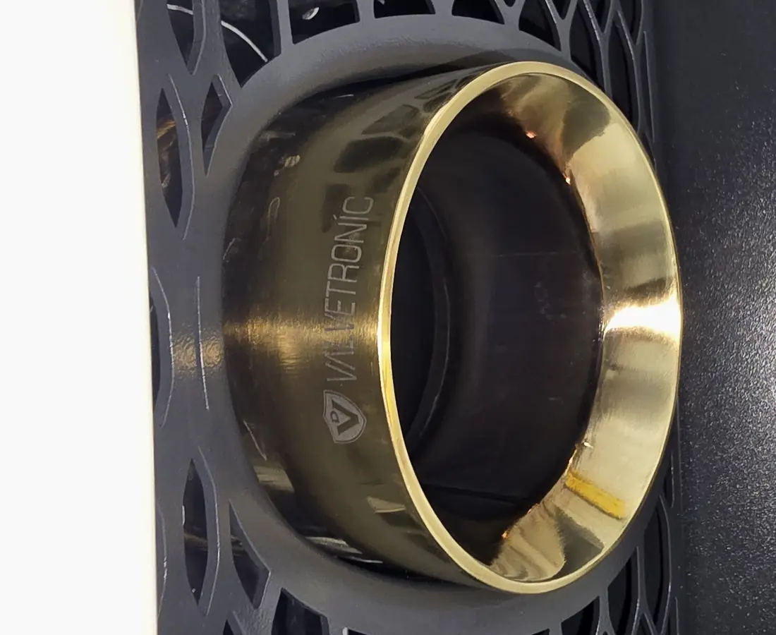 The same exhaust tip polished back to a clean mirror finish