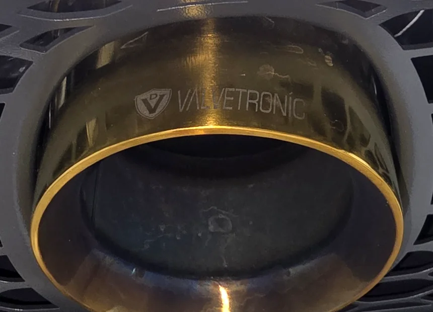 A Valvetronic exhaust tip tarnished and heat-discolored before polishing