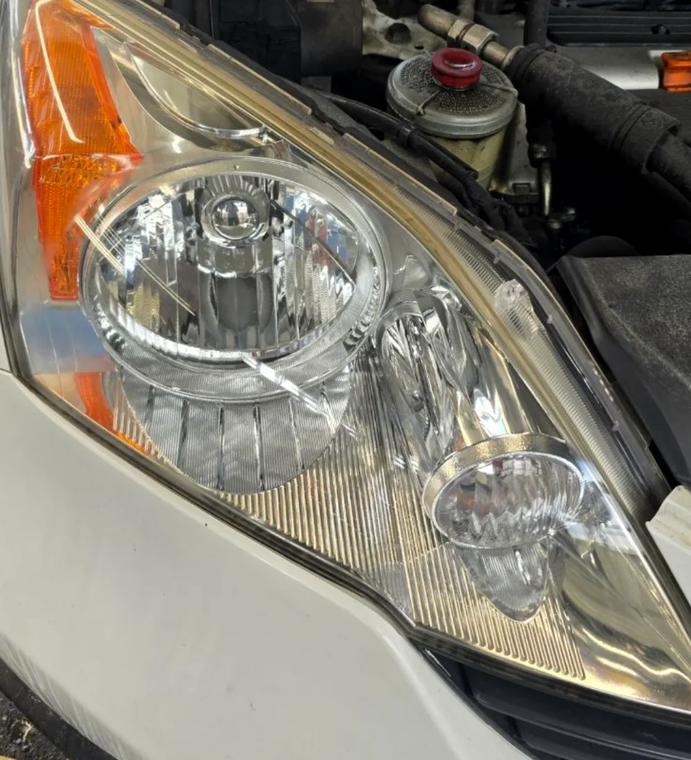 The same headlight lens after restoration, clear again