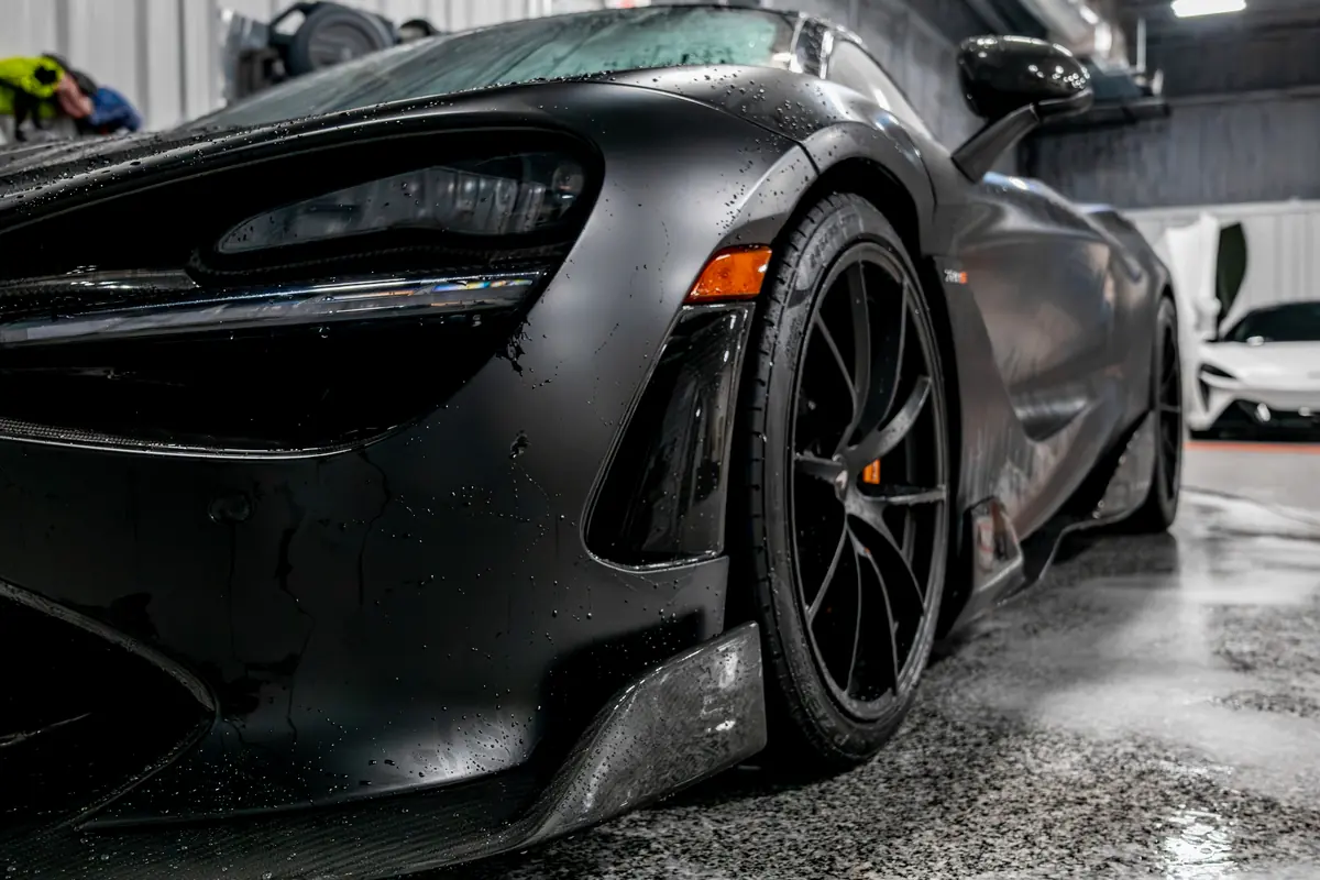 A McLaren 720S in profile inside the bay