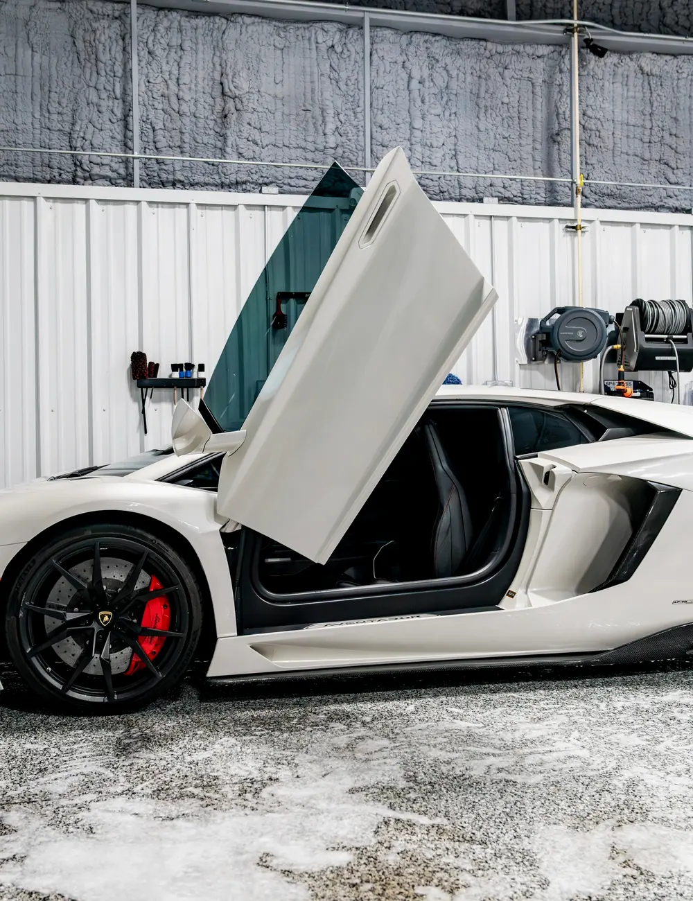 A Lamborghini Aventador with the doors raised