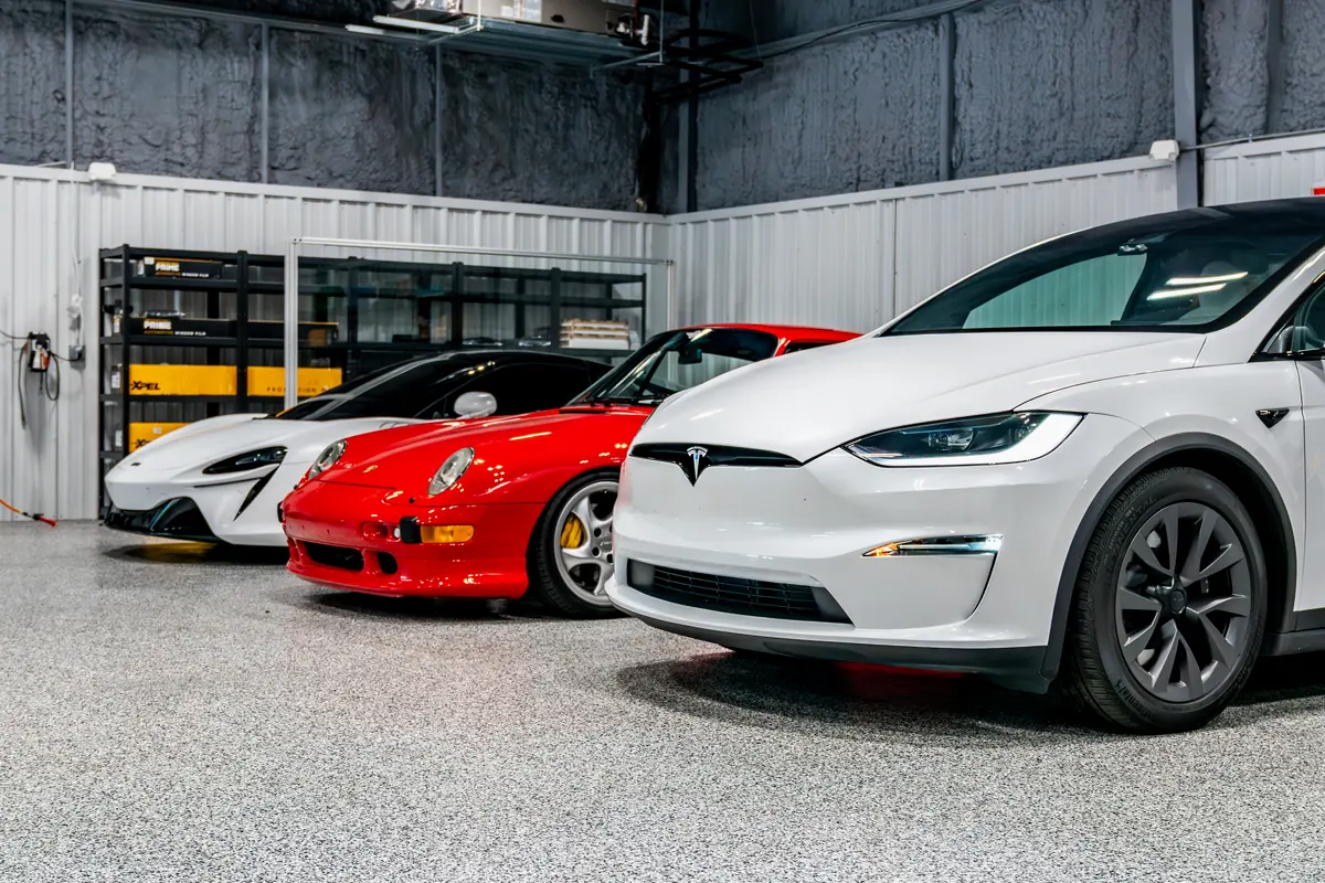 A row of vehicles waiting inside the Detail Geex bay